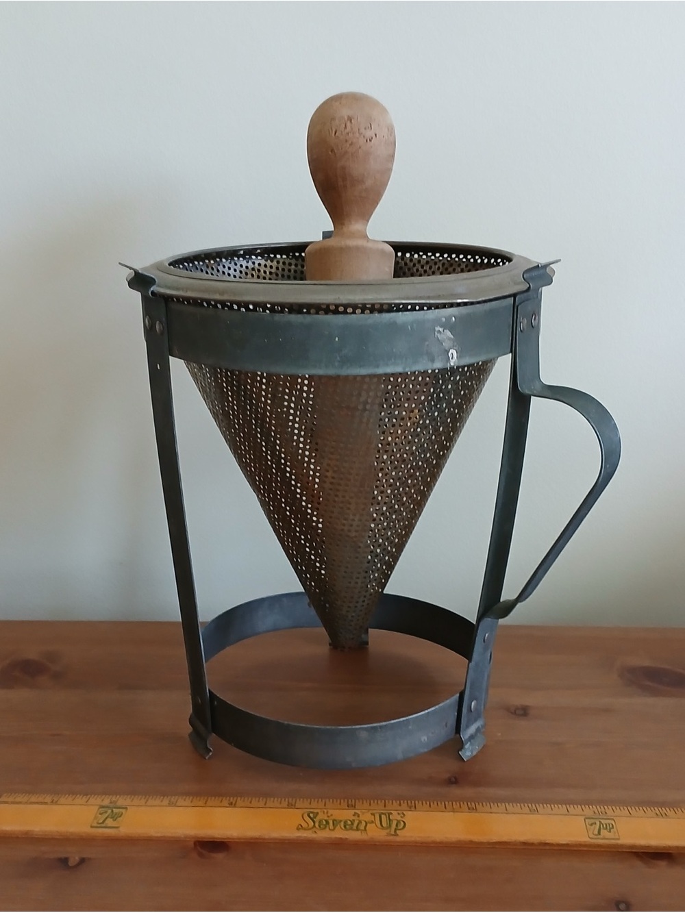 Rustic vintage metal cone strainer
with wood pestle/masher